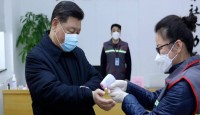 China's daily death toll from virus tops...